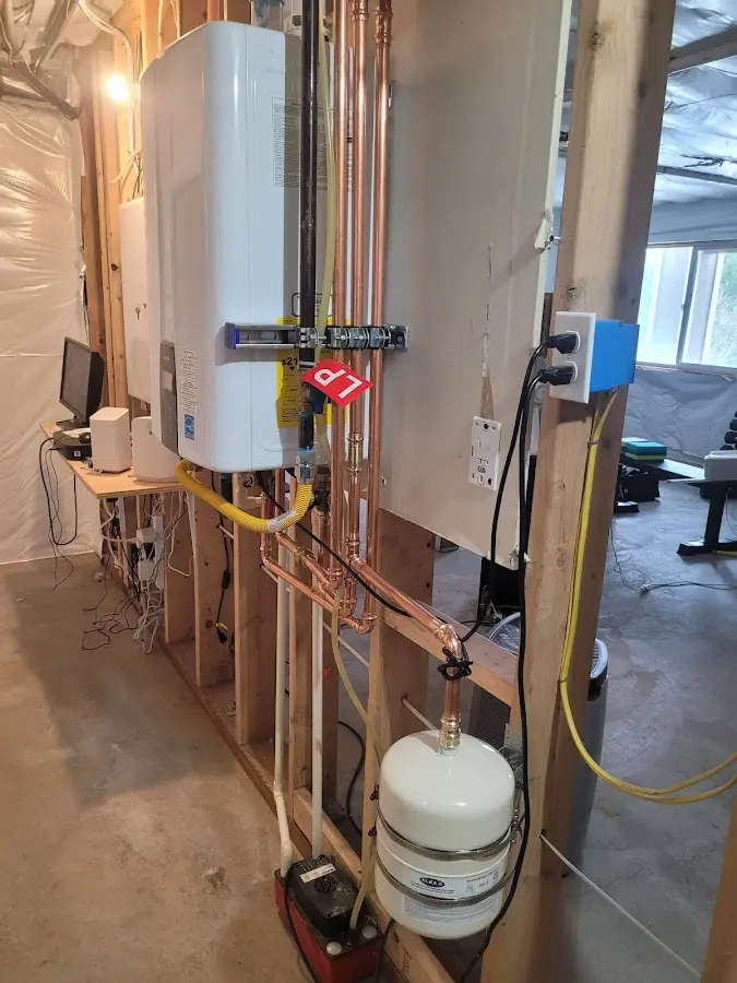Licensed plumber repairing a kitchen sink in Holladay