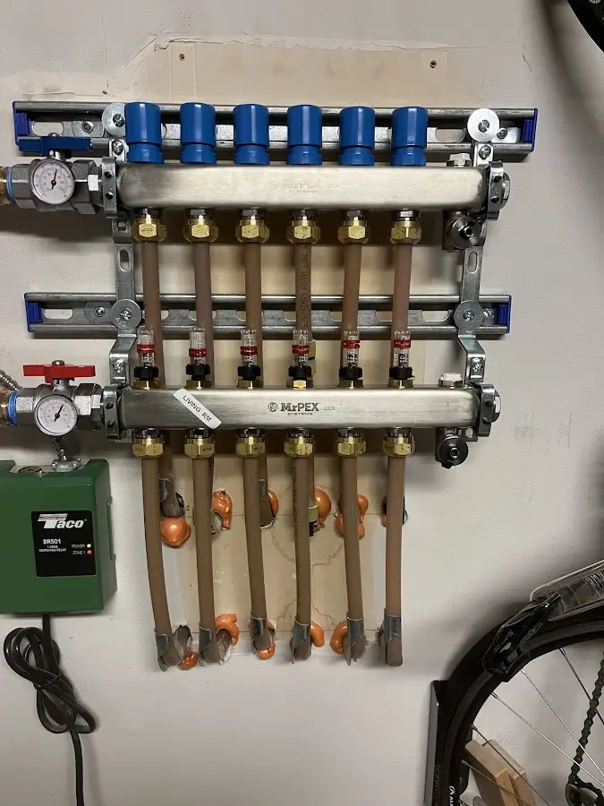 Plumber performing Gas Line Installation at a residential property in Holladay